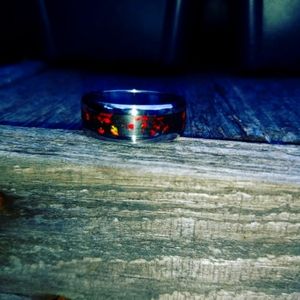 Fire opal set in crushed coal